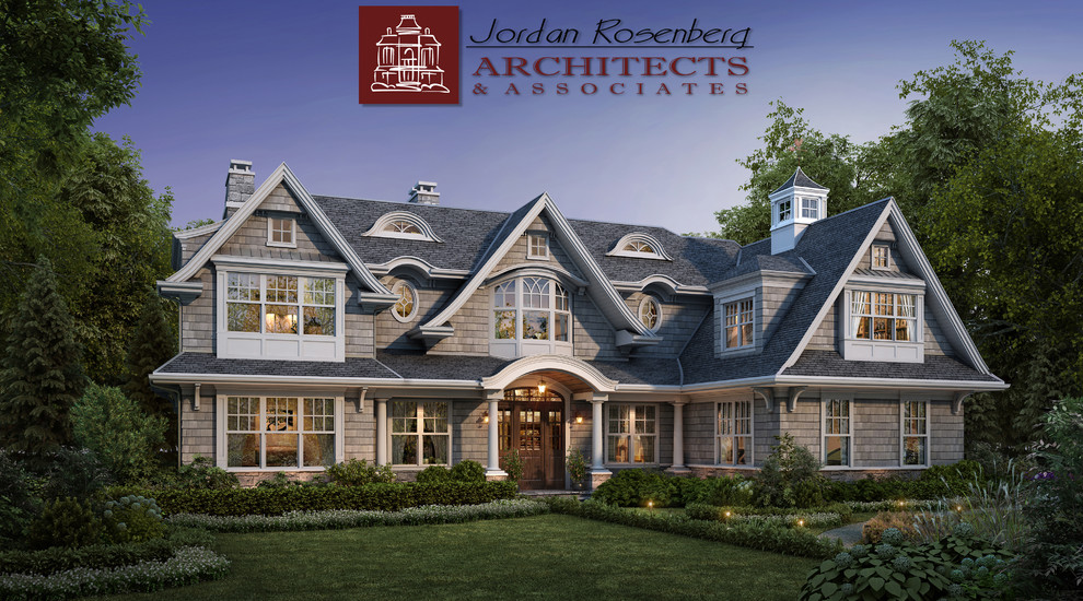 Large arts and crafts two-storey grey house exterior in New York with wood siding, a gable roof and a shingle roof.