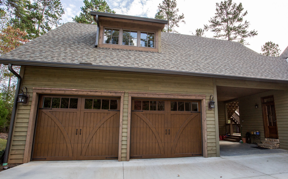 This is an example of a large arts and crafts detached two-car garage in Other.