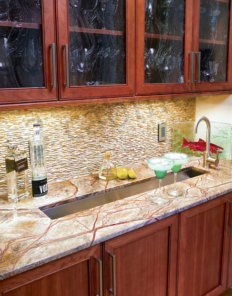 Inspiration for a transitional single-wall eat-in kitchen remodel in Charlotte with an undermount sink, flat-panel cabinets, medium tone wood cabinets, marble countertops, beige backsplash, stone tile backsplash and stainless steel appliances