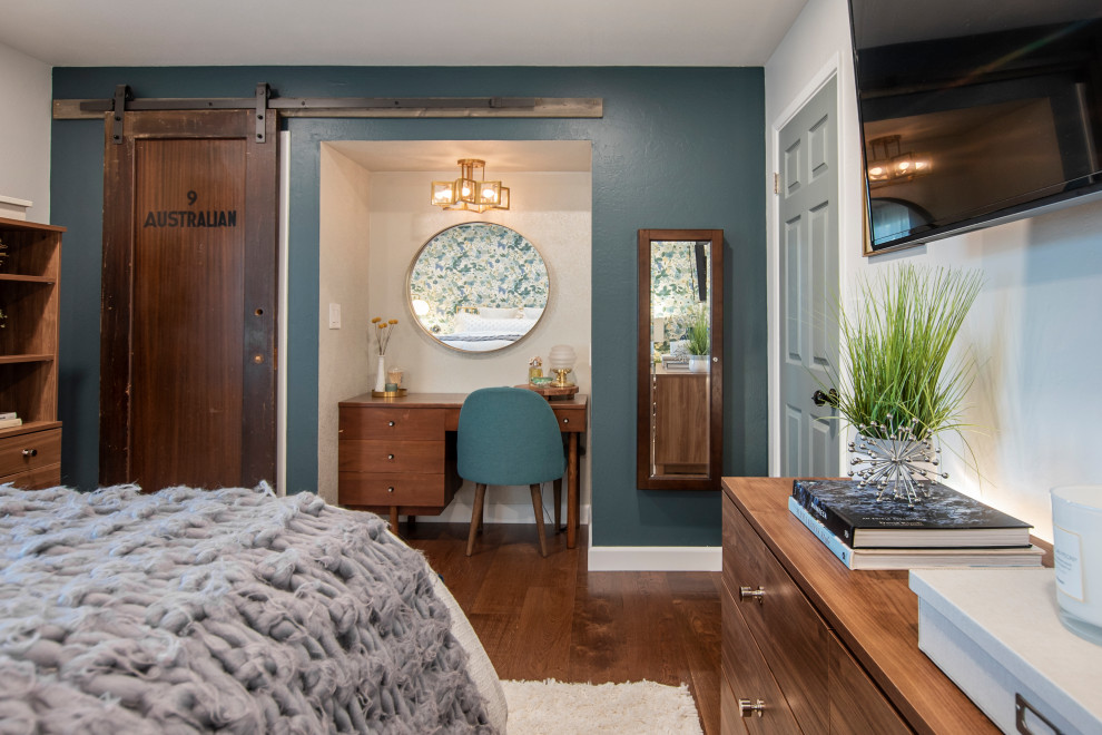 Small midcentury master bedroom in San Francisco with white walls, dark hardwood floors, brown floor and wallpaper.