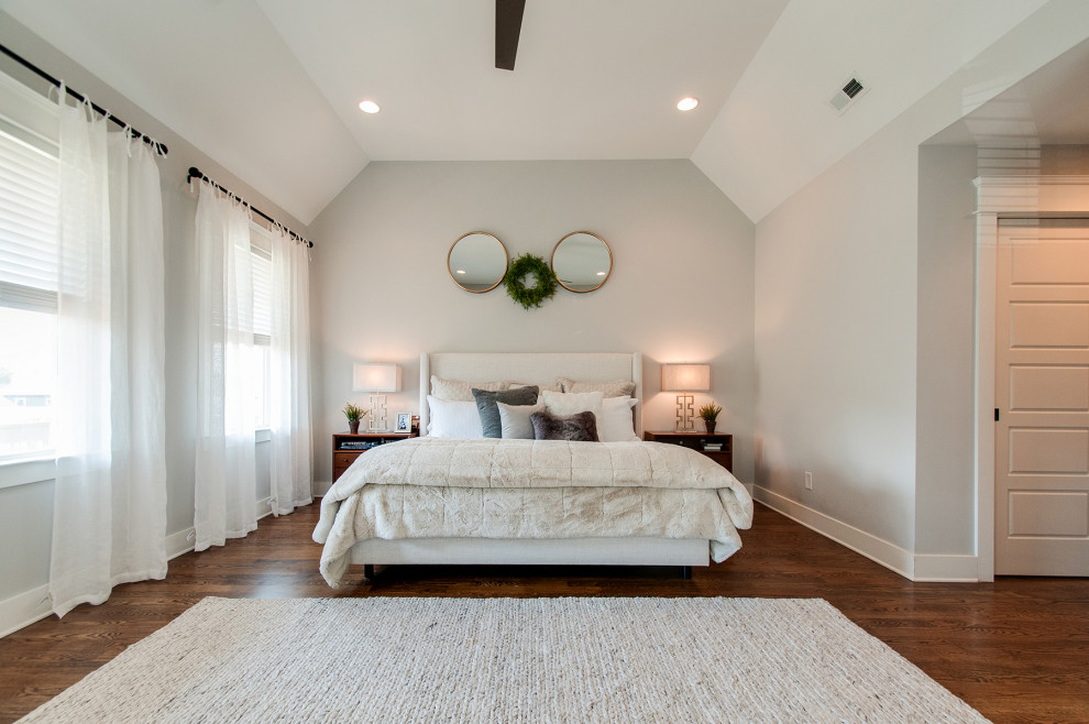Design ideas for a medium sized retro master bedroom in Nashville with grey walls, medium hardwood flooring, brown floors and a vaulted ceiling.