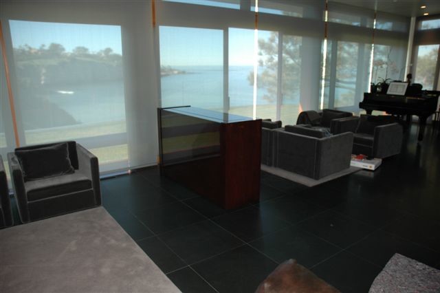 This is an example of a mid-sized modern open concept family room in San Diego with a concealed tv.
