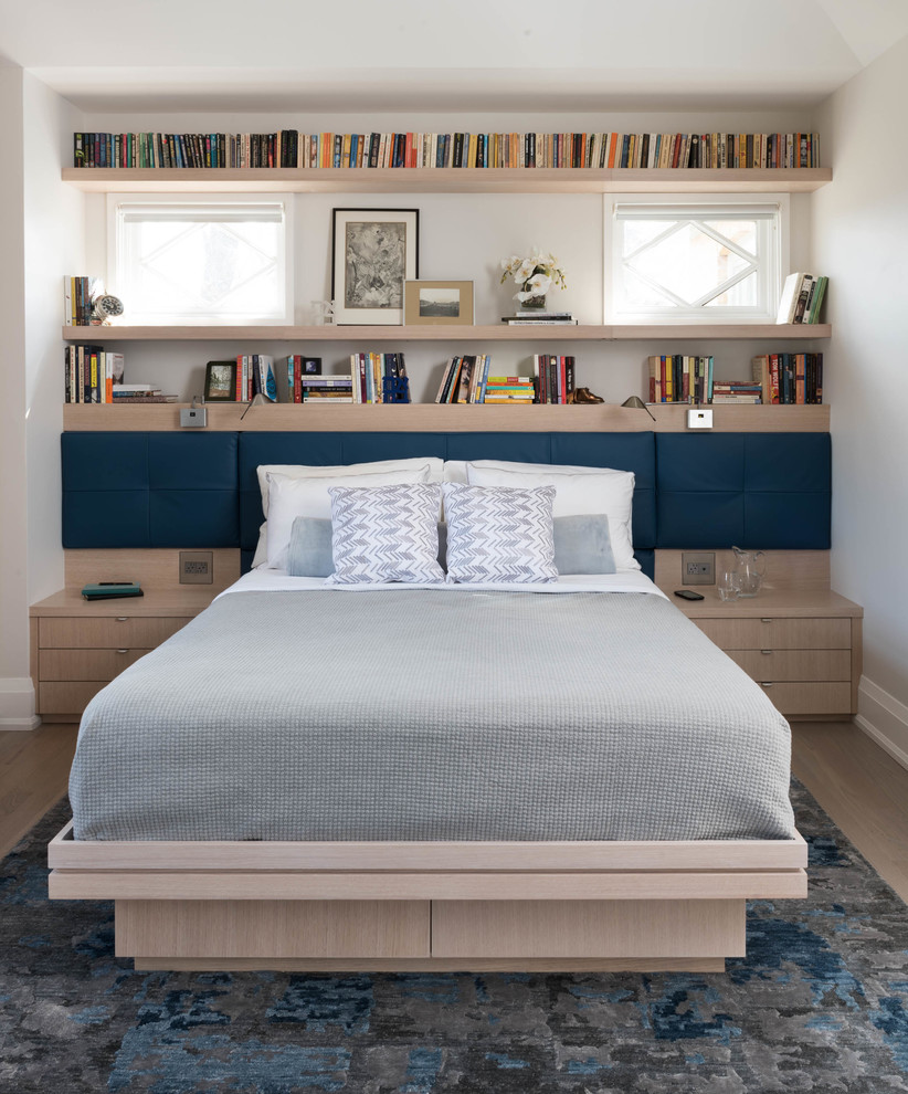 Contemporary master bedroom in Toronto with grey walls, light hardwood floors and beige floor.