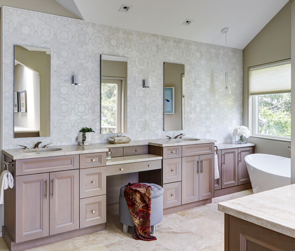 This is an example of an expansive contemporary master bathroom in Chicago with recessed-panel cabinets, brown cabinets, a freestanding tub, beige tile, stone tile, beige walls, limestone floors, an undermount sink, quartzite benchtops, beige floor, beige benchtops, a double vanity, a built-in vanity and vaulted.
