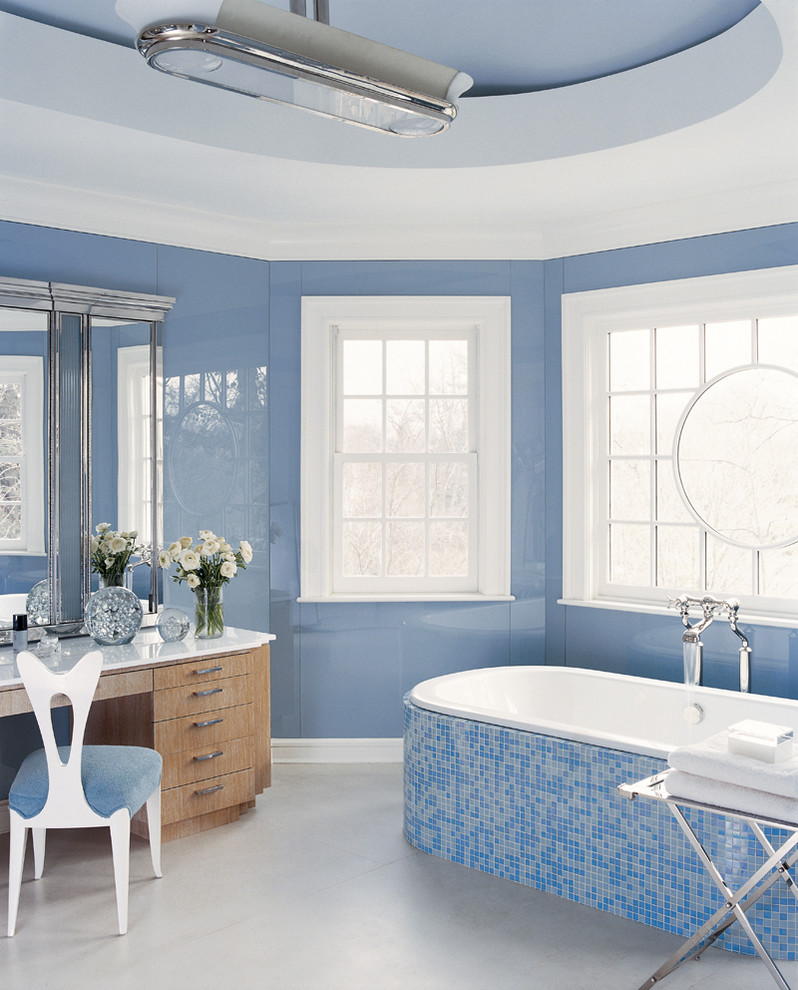 Inspiration for a traditional bathroom in New York with blue tile, mosaic tile and blue walls.