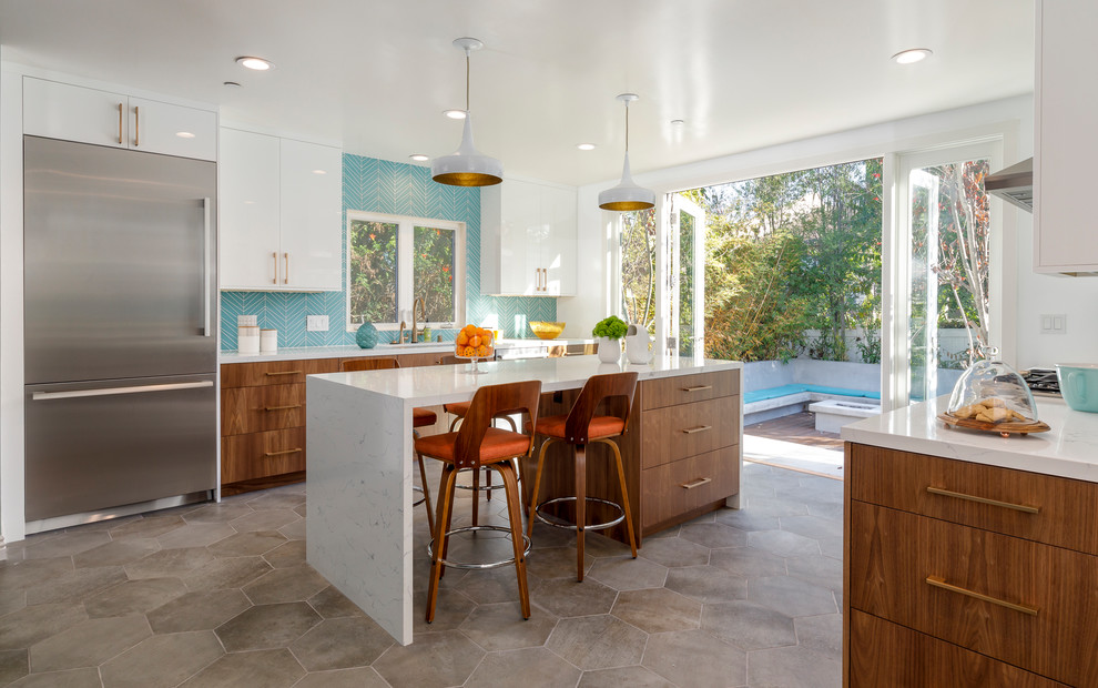 Inspiration for a large midcentury u-shaped separate kitchen in Los Angeles with an undermount sink, flat-panel cabinets, medium wood cabinets, quartzite benchtops, blue splashback, glass tile splashback, stainless steel appliances, cement tiles, with island and grey floor.