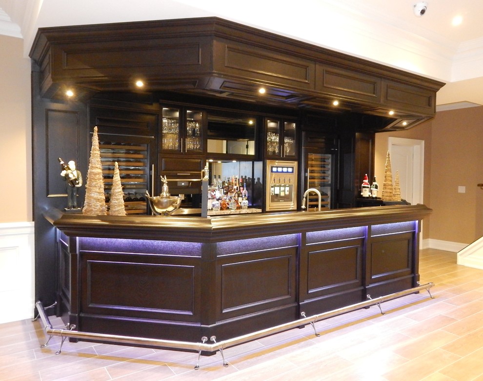 This is an example of a large contemporary galley seated home bar in Toronto with dark wood cabinets, wood benchtops, mirror splashback, porcelain floors and brown floor.
