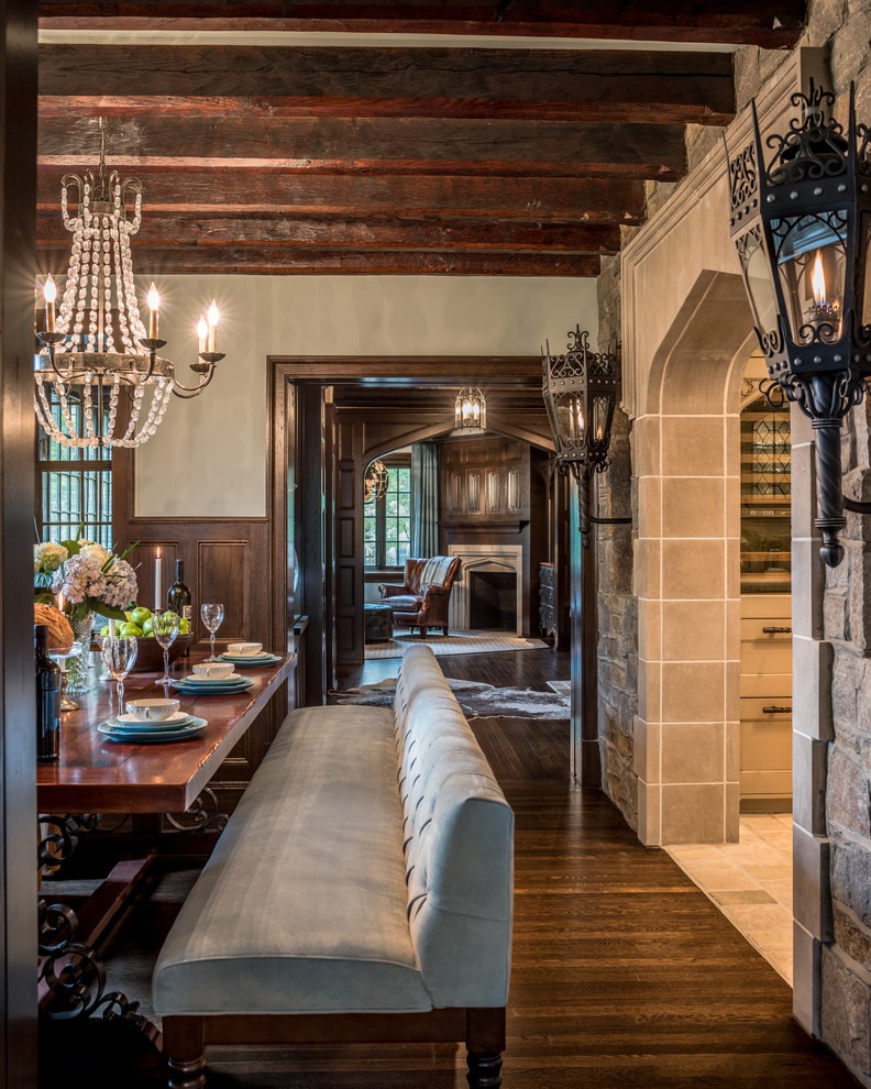 Inspiration for a mid-sized traditional separate dining room in Philadelphia with dark hardwood floors, a corner fireplace, a stone fireplace surround and white walls.