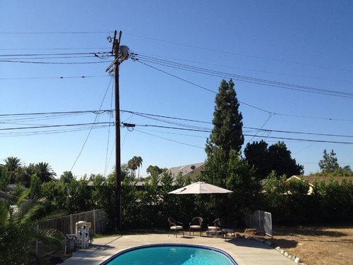 need help - electric pole eyesore in my backyard