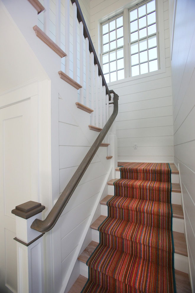 Mid-sized beach style wood l-shaped staircase in Philadelphia with painted wood risers.