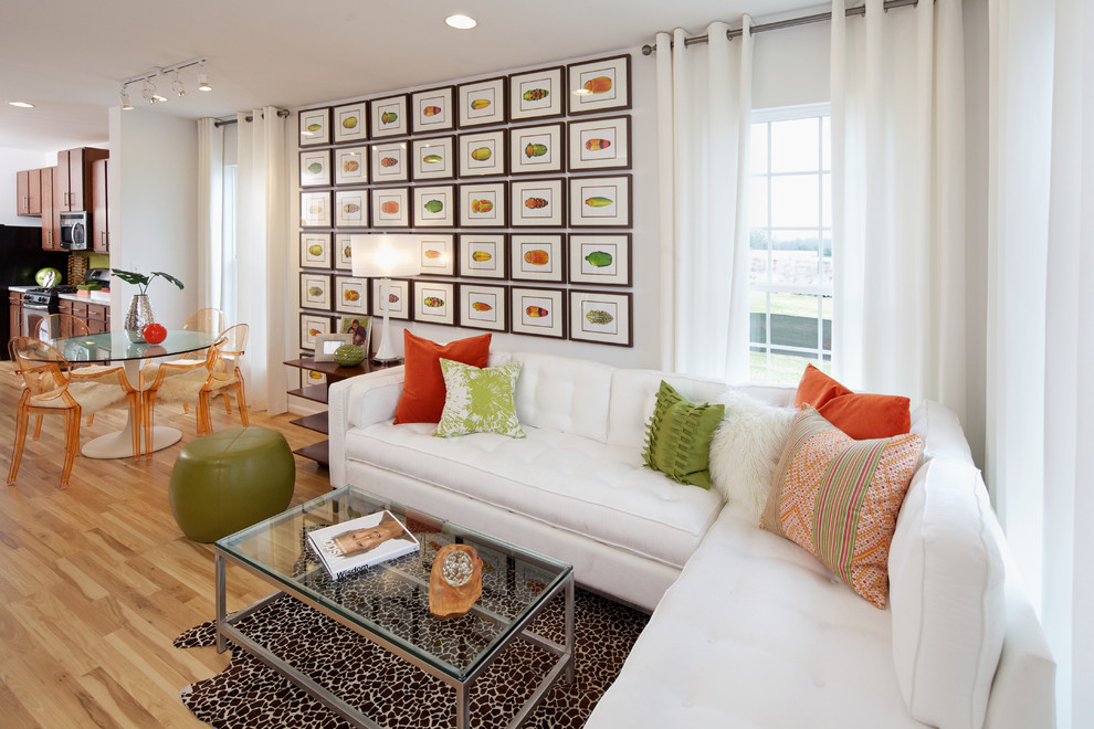 Photo of a contemporary open concept living room in DC Metro with white walls.