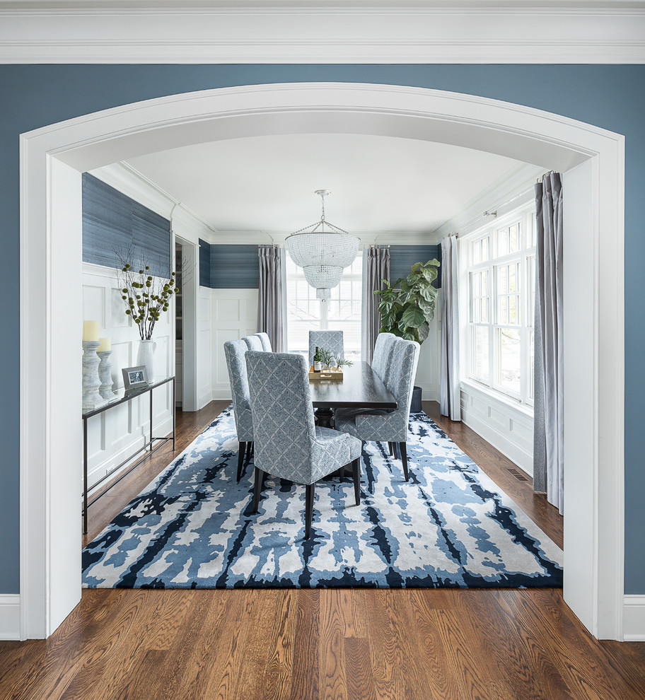 Design ideas for a mid-sized transitional separate dining room in Chicago with blue walls, medium hardwood floors and brown floor.
