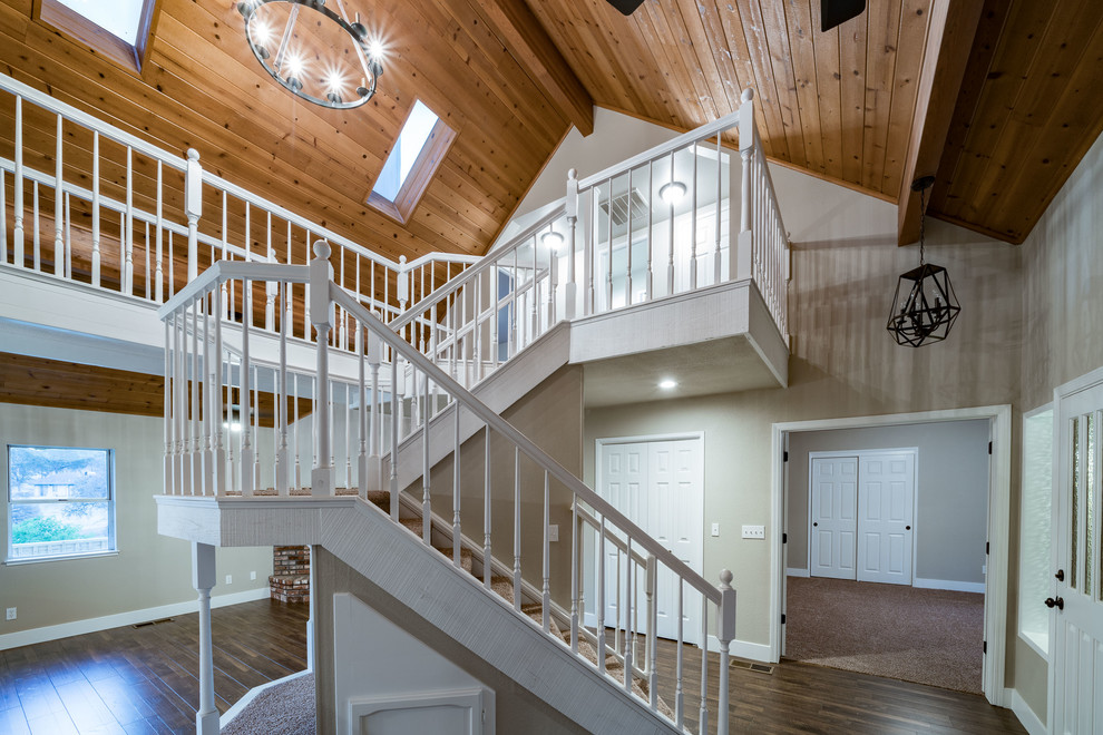 Mid-sized transitional carpeted u-shaped wood railing staircase photo with carpeted risers
