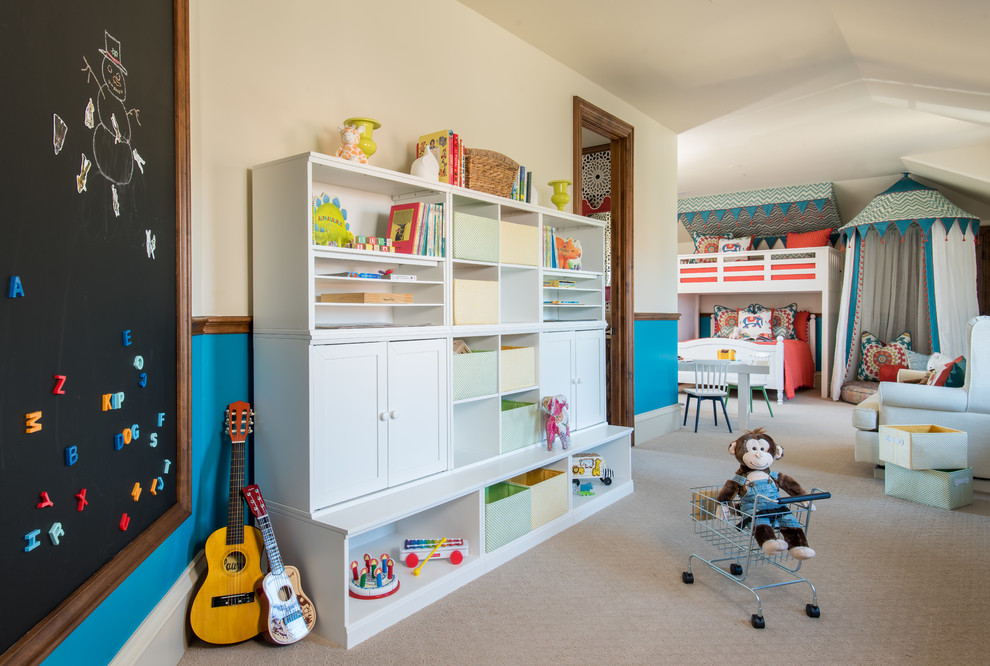 Design ideas for a large gender-neutral kids' bedroom for kids 4-10 years old in Dallas with blue walls, carpet and beige floor.