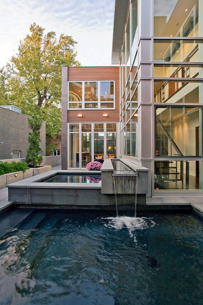 Inspiration for a small modern pool in Chicago with a water feature.