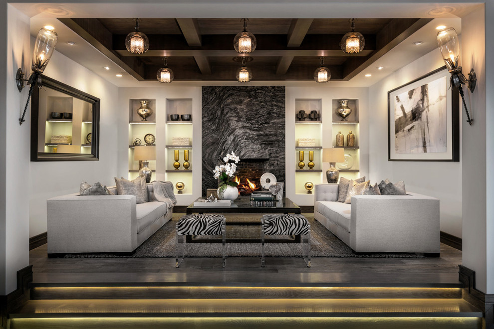 Inspiration for a mediterranean formal living room remodel in Orange County with white walls and a stone fireplace