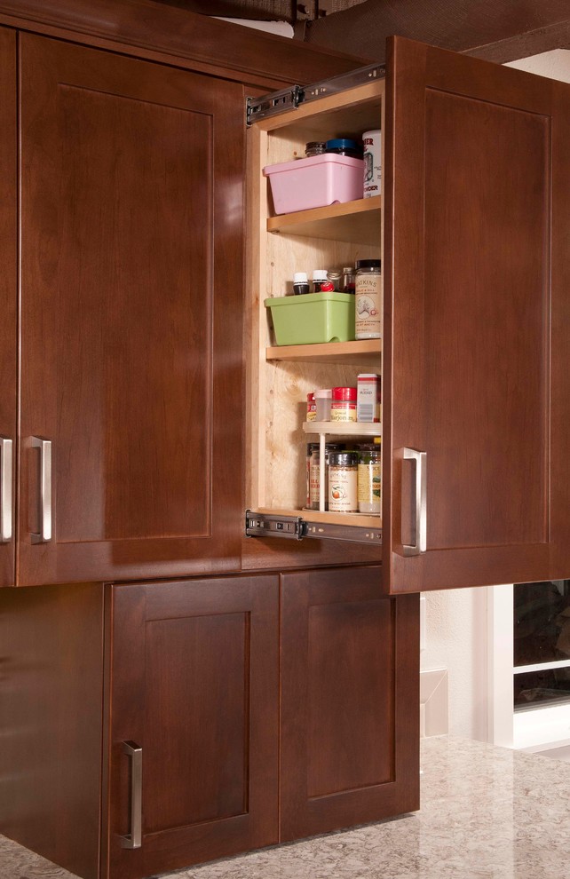Kitchen - mid-sized transitional dark wood floor kitchen idea in Seattle with an undermount sink, shaker cabinets, dark wood cabinets, beige backsplash, subway tile backsplash, stainless steel appliances and a peninsula