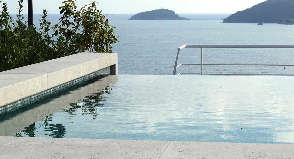 Inspiration for a contemporary rooftop infinity pool in Other.