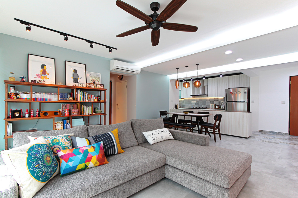 Photo of an eclectic open concept living room in Singapore with blue walls.