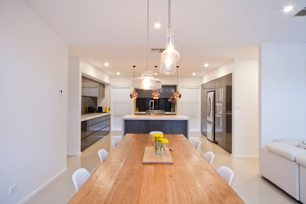 Design ideas for a contemporary open plan dining in Canberra - Queanbeyan with white walls and no fireplace.