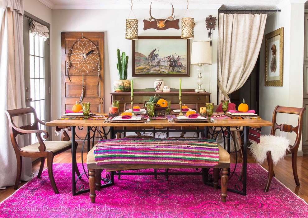 This is an example of an eclectic dining room in Other with beige walls, medium hardwood floors and brown floor.