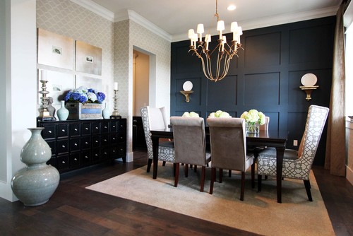 dining room with blue accent wall and geometric wallpaper