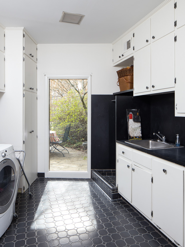 Mid-sized midcentury galley dedicated laundry room in Birmingham with a drop-in sink, flat-panel cabinets, white cabinets, laminate benchtops, white walls, ceramic floors and a side-by-side washer and dryer.