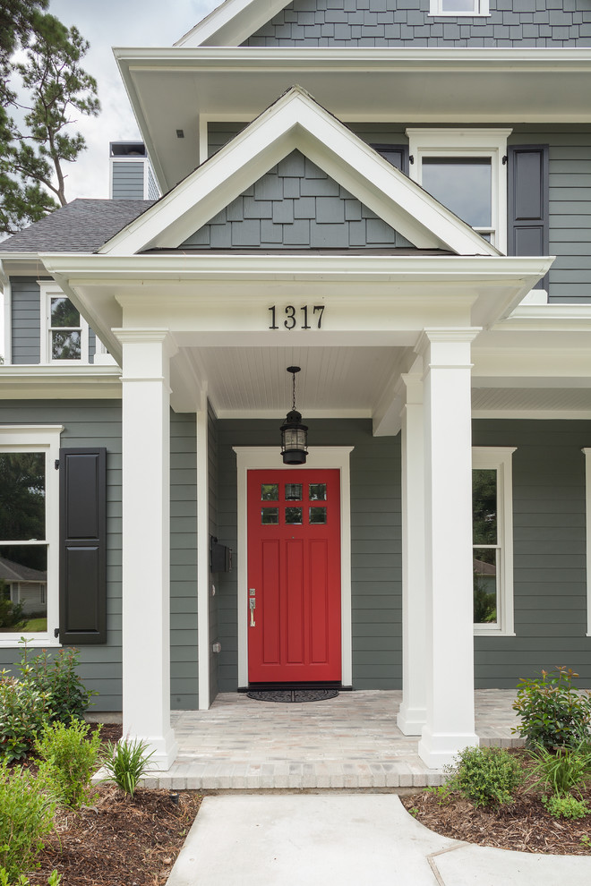 Photo of a traditional entryway in Houston with a red front door.