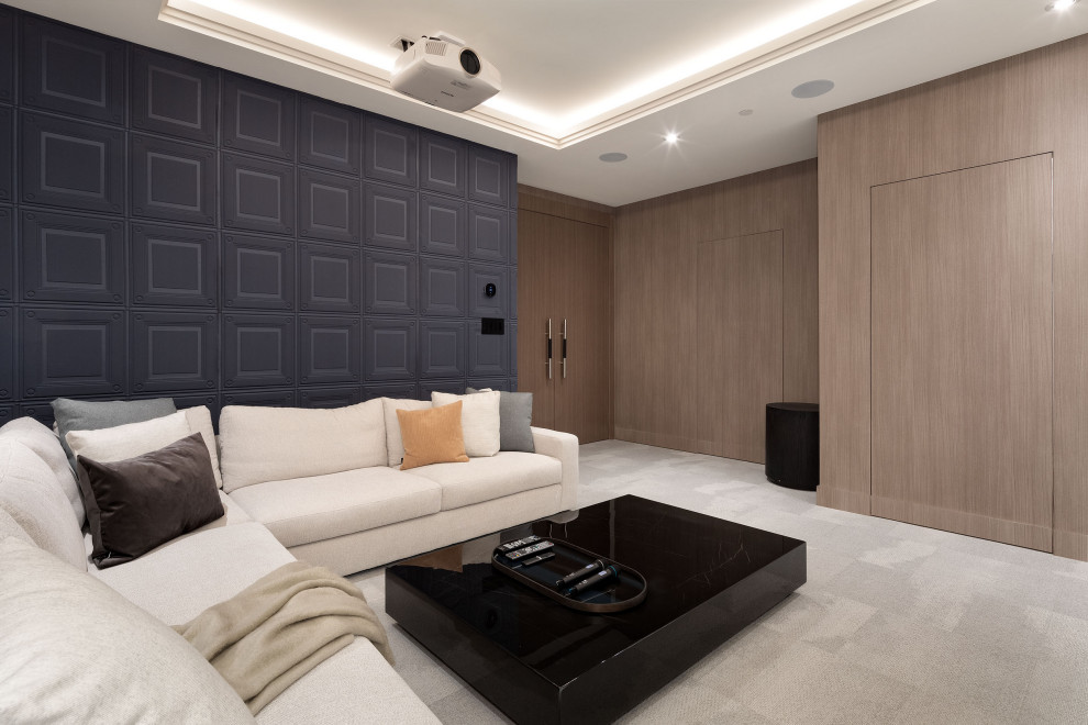 Example of a huge enclosed carpeted and beige floor home theater design in Vancouver with brown walls and a projector screen