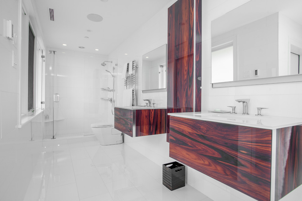 This is an example of a contemporary bathroom in Boston with flat-panel cabinets, dark wood cabinets, an alcove shower and white tile.