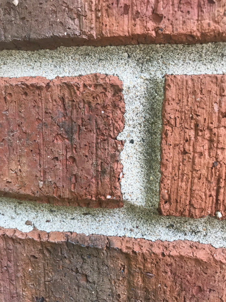 Brick Retaining Wall Restoration from Previous Failed Mortar Matching Repairs