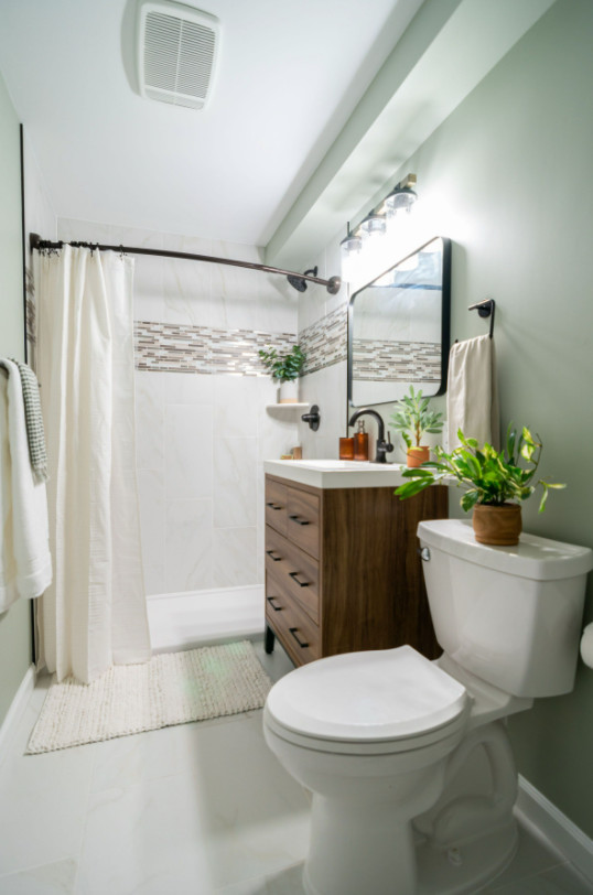 Design ideas for a small traditional 3/4 bathroom in Minneapolis with flat-panel cabinets, medium wood cabinets, an alcove shower, a wall-mount toilet, beige tile, ceramic tile, blue walls, cement tiles, an undermount sink, zinc benchtops, white floor, a shower curtain, white benchtops, a single vanity and a freestanding vanity.