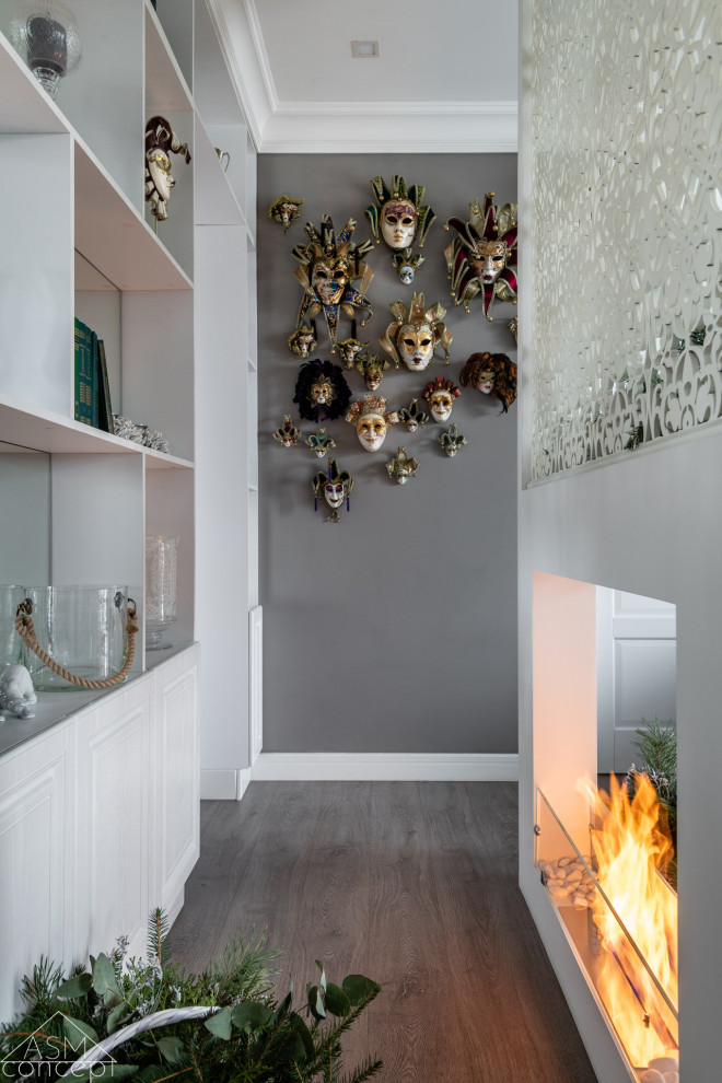 Photo of a mid-sized transitional hallway in Moscow with grey walls, laminate floors and beige floor.