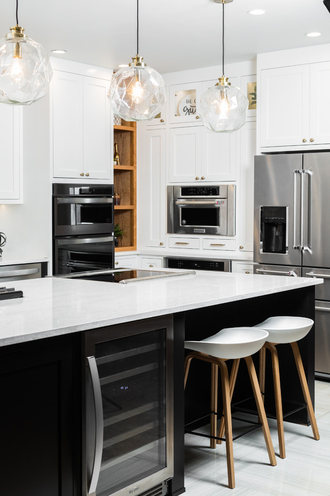 Inspiration for a mid-sized transitional l-shaped porcelain tile and beige floor enclosed kitchen remodel in Albuquerque with shaker cabinets, white cabinets, quartz countertops, white backsplash, mosaic tile backsplash, stainless steel appliances, an island and white countertops