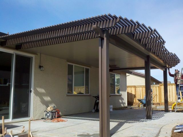 Mid-sized backyard patio in Sacramento with concrete slab and an awning.