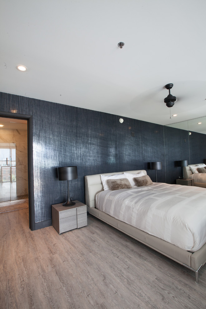Inspiration for a mid-sized modern master bedroom in Atlanta with black walls and vinyl floors.
