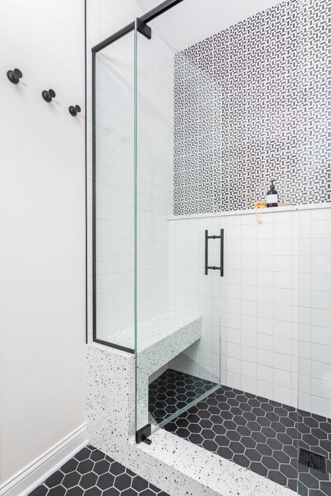 Design ideas for a medium sized contemporary shower room bathroom in Chicago with flat-panel cabinets, beige cabinets, an alcove shower, white walls, mosaic tile flooring, a built-in sink, quartz worktops, black floors, a hinged door, multi-coloured worktops, double sinks and a built in vanity unit.