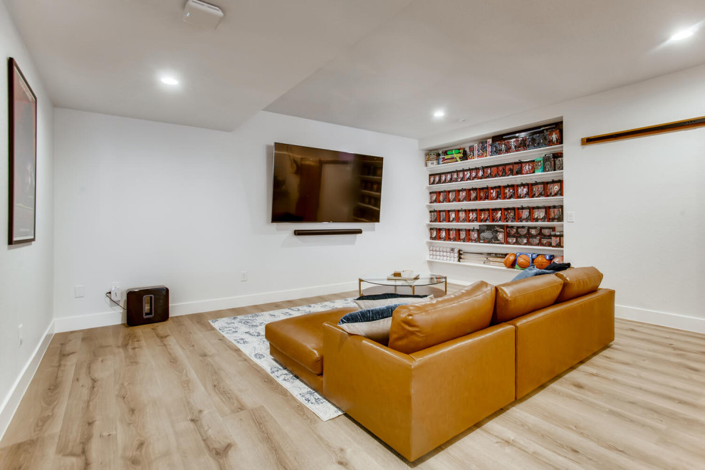 Inspiration for a large contemporary walk-out basement in Denver with a home bar, grey walls, vinyl floors and brown floor.