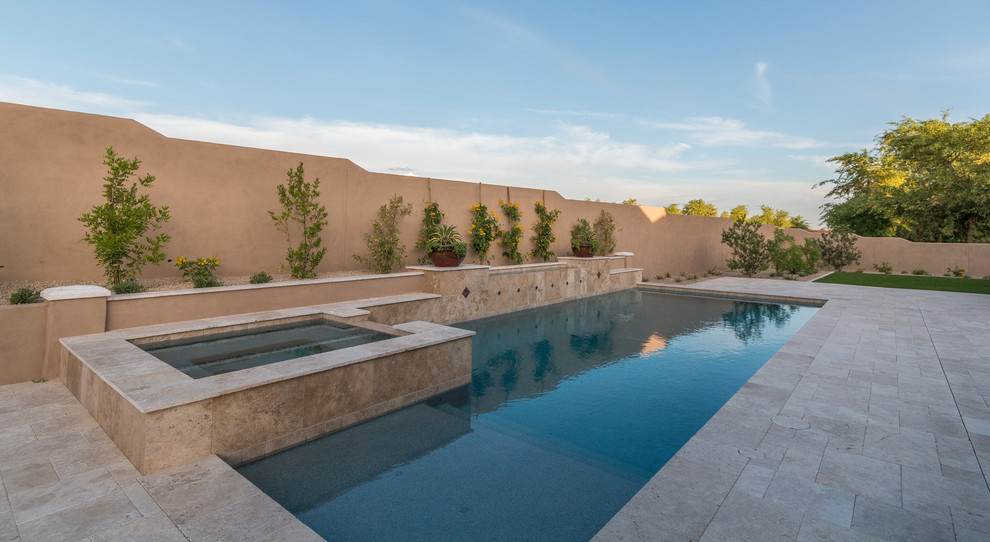 Inspiration for a huge transitional two-story stucco beige pool remodel in Phoenix with a tile roof