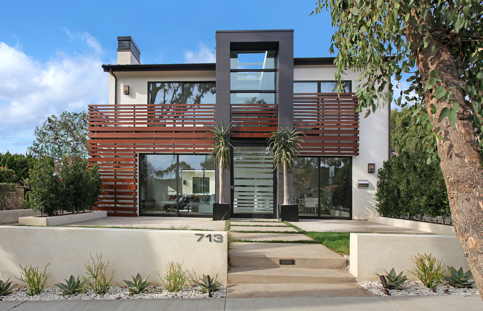 Design ideas for a contemporary two-storey white exterior in Orange County.