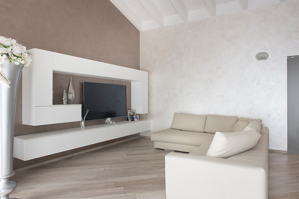 Photo of a mid-sized contemporary family room in Milan.