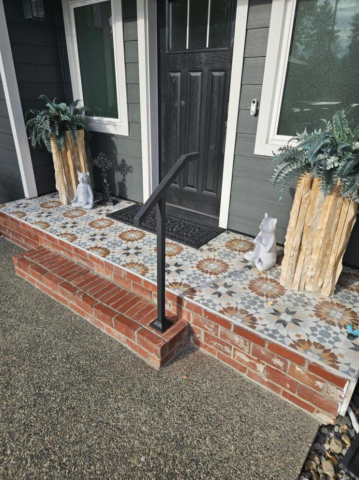 Inspiration for a small 1950s metal railing front porch remodel in Los Angeles