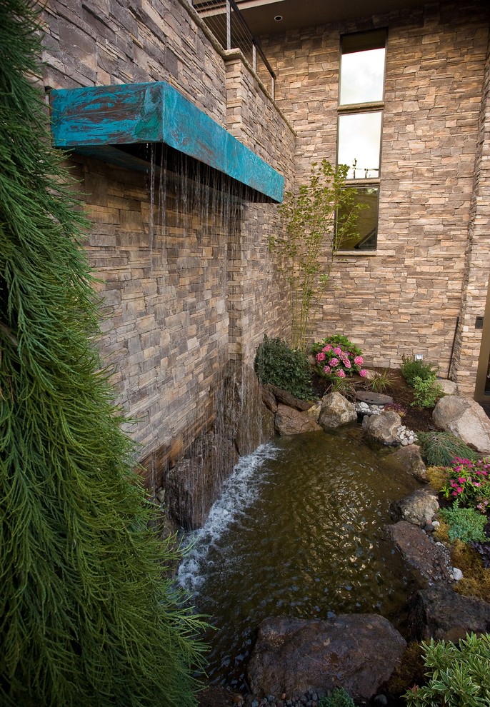 Design ideas for a traditional garden in Portland with a water feature.