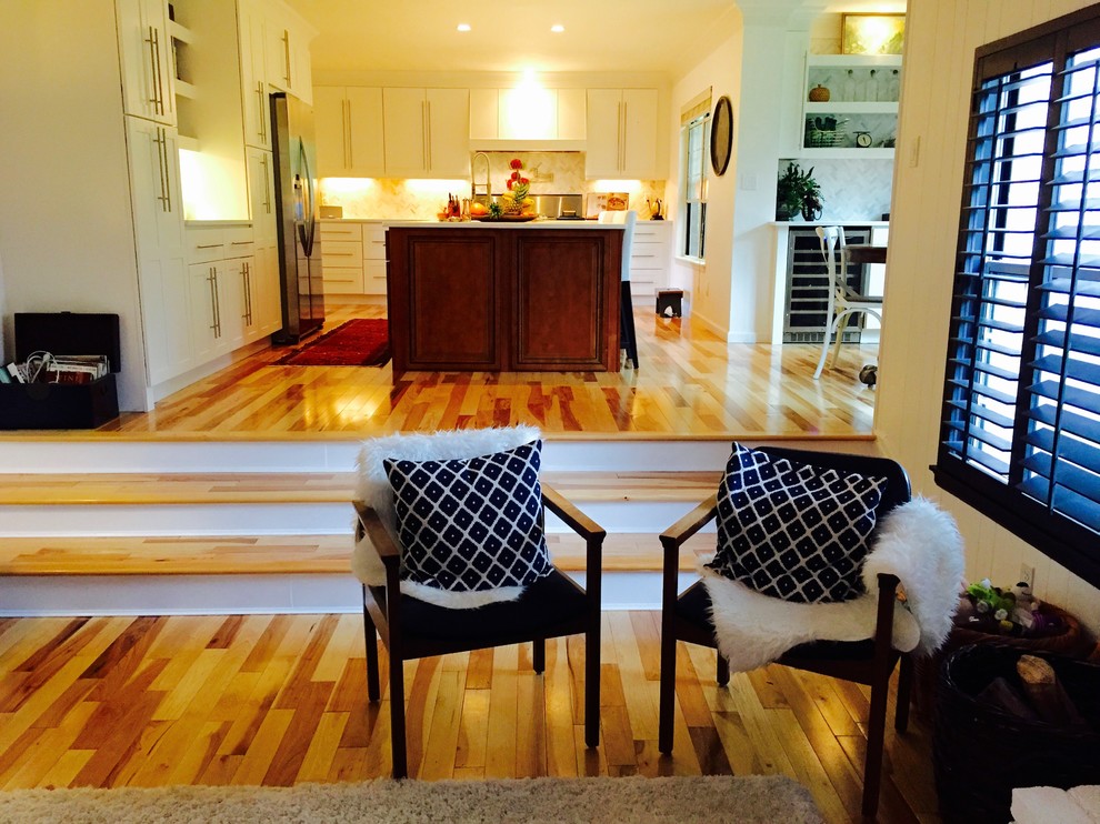 Example of a transitional home design design in Denver