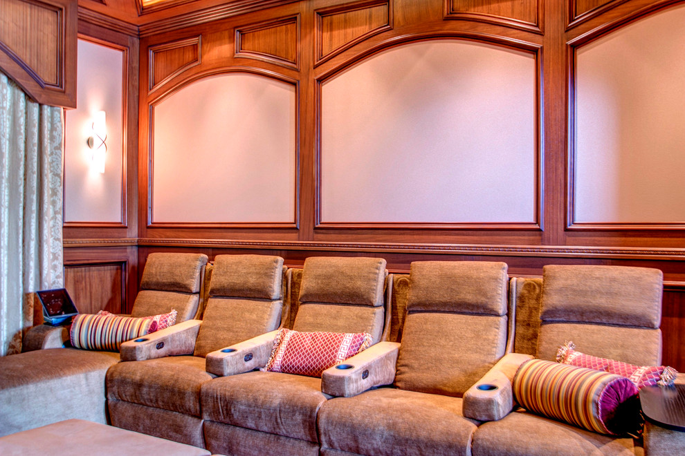 Photo of a mid-sized traditional enclosed home theatre in San Diego with brown walls, carpet and a projector screen.
