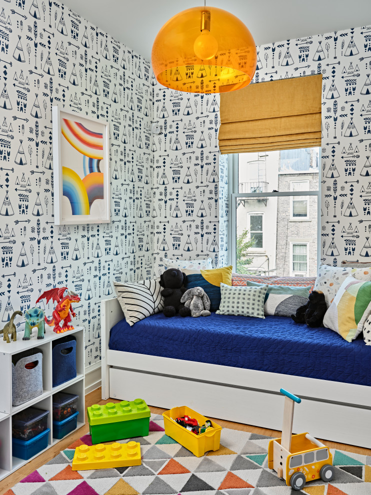 Kids' bedroom - bedroom contemporary boy medium tone wood floor, brown floor and wallpaper kids' bedroom idea in New York with multicolored walls