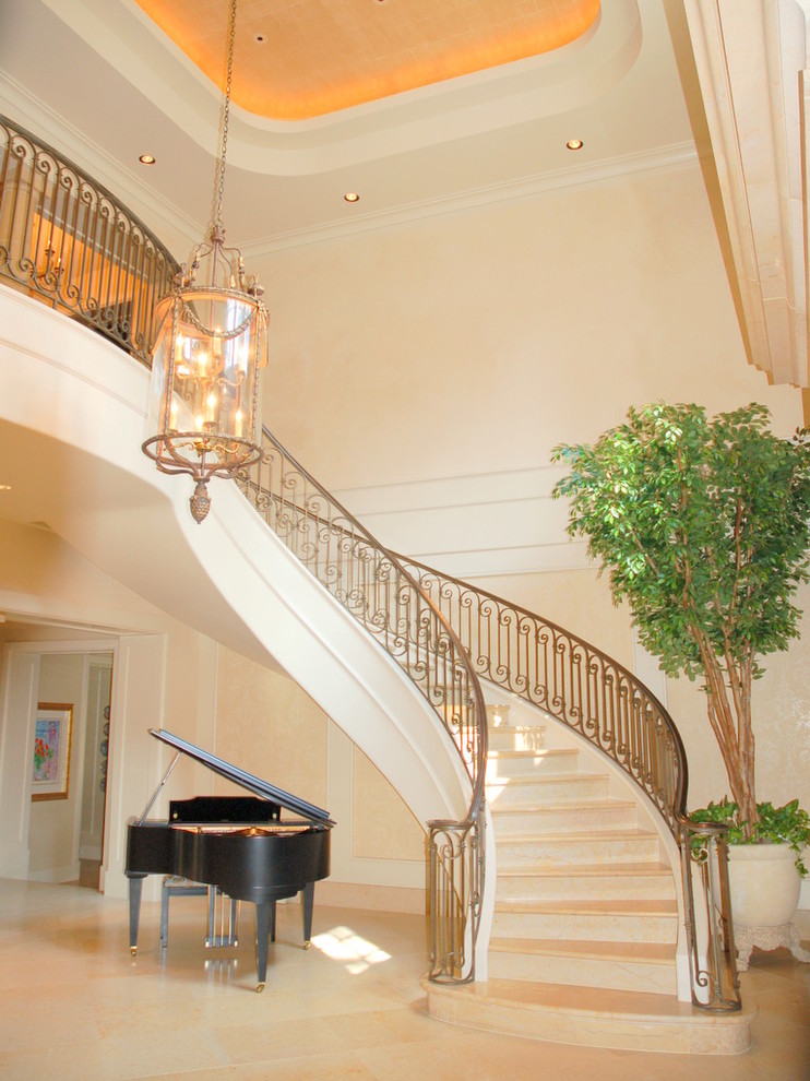 This is an example of a mid-sized traditional curved staircase in Houston.