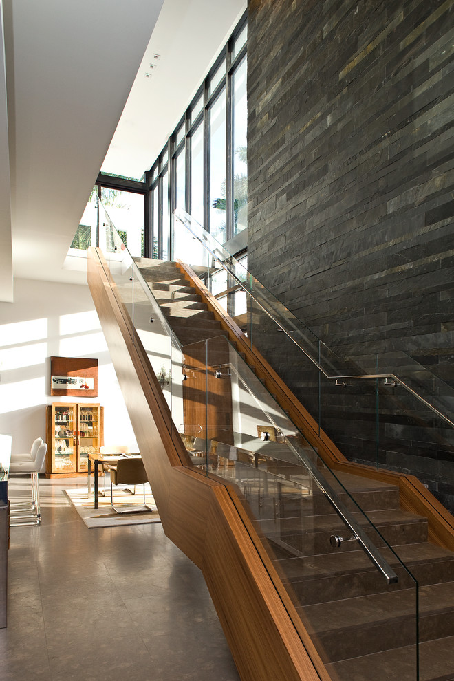This is an example of a contemporary straight staircase in Miami.