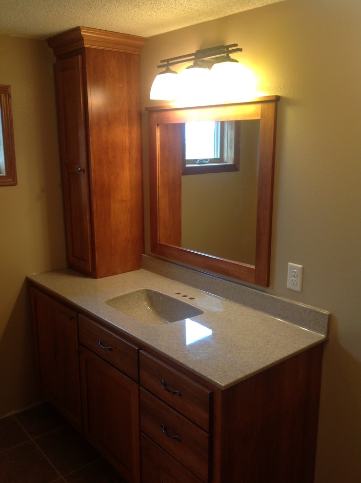 Example of a mid-sized master bathroom design with beaded inset cabinets and medium tone wood cabinets