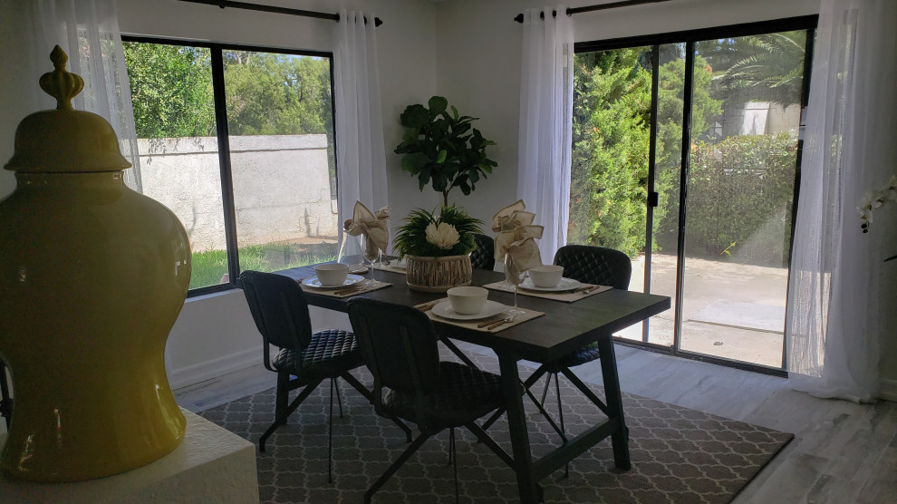 Example of a transitional dining room design in Orange County